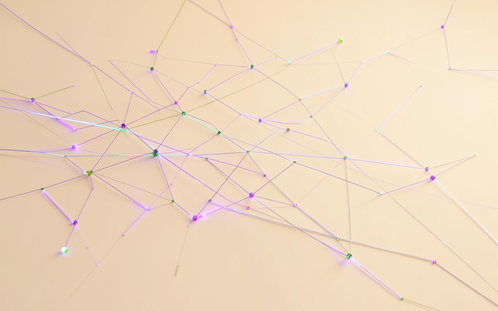 Abstract network of fine violet and lime lines connecting nodes
